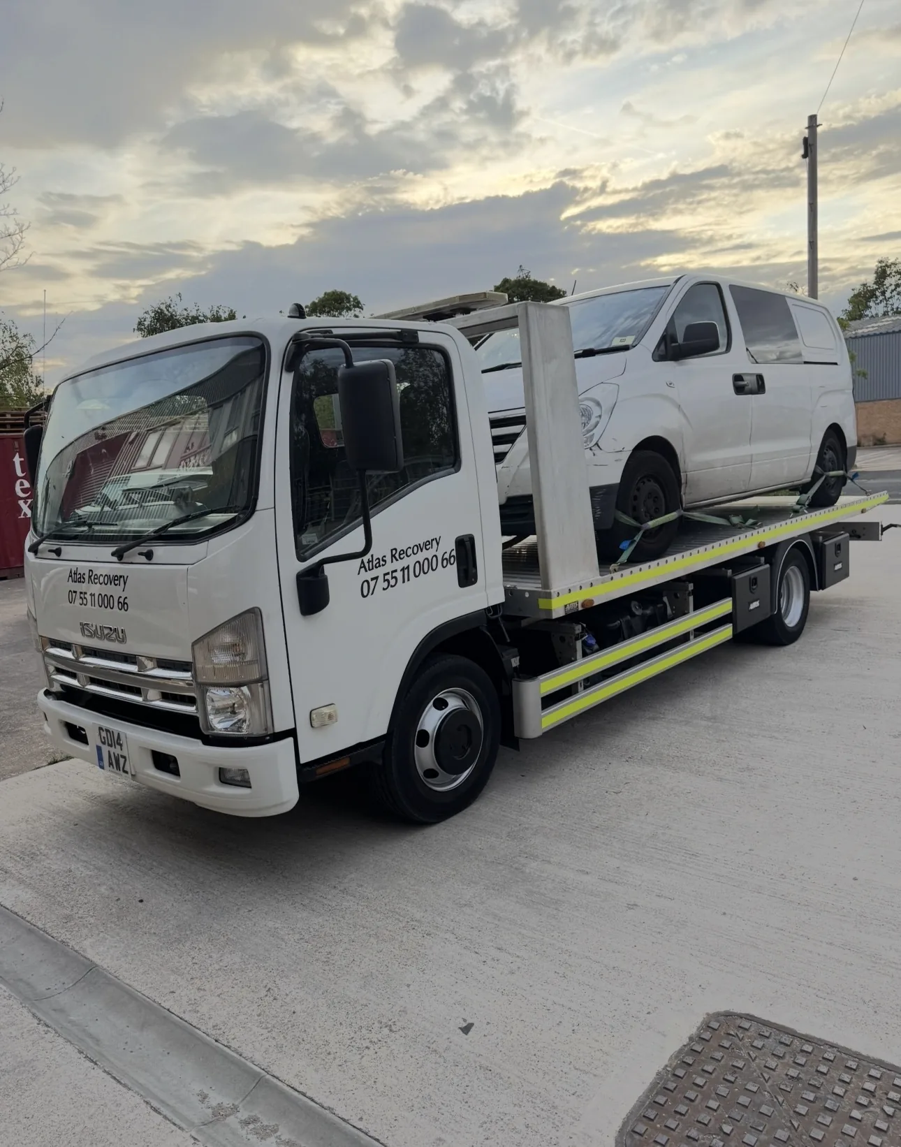 Atlas Recovery truck carrying a van
